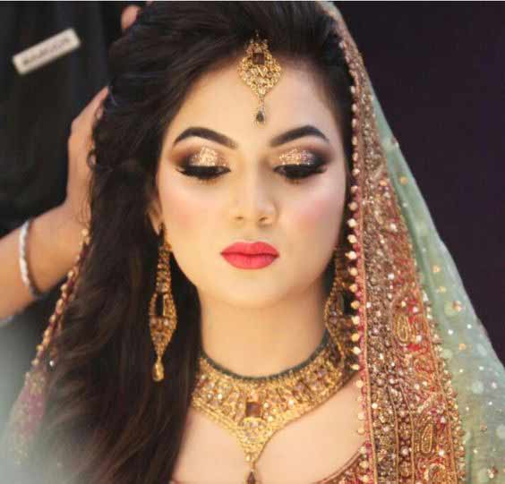 Latest Pakistani engagement makeup with light green and golden dress