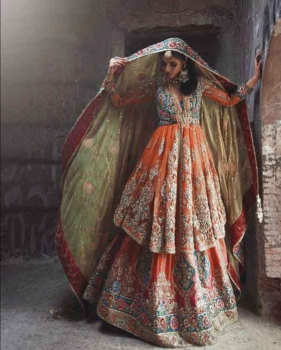 Orange peplum frock with lehenga and dupatta for Pakistani wedding brides