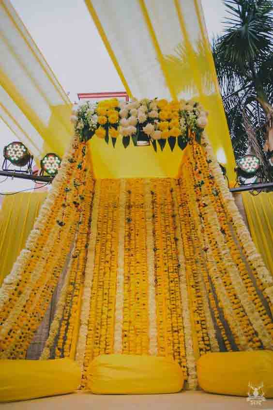 Orange canopy decor for mehndi at home