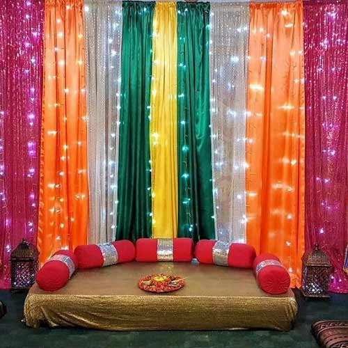 Colorful curtains for mehndi stage decor at home