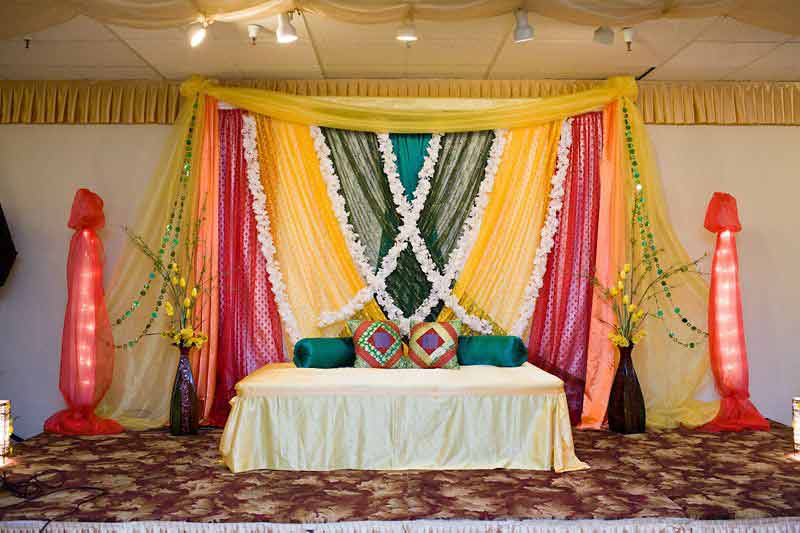 Multicolor mehndi stage decor at home