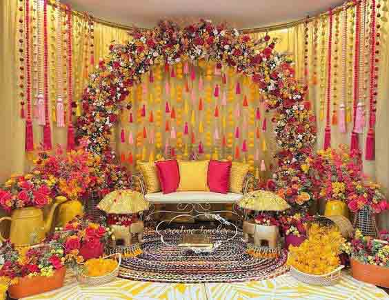 Ring mehndi stage decor with colorful flowers