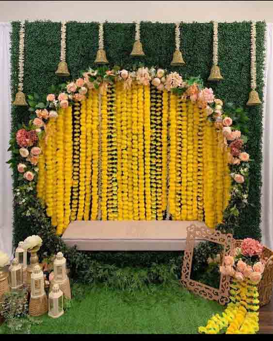 Green ring mehndi stage decor at home