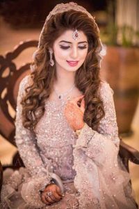 Latest Pakistani bridal makeup with pink dress