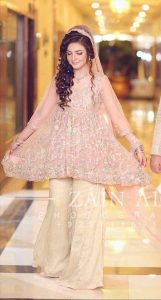 Pink short frock with off white sharara for engagement