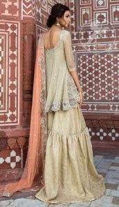 Off white short frock with peach dupatta for engagement