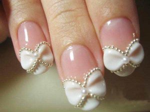 Cute white bow with pearls nail art for Pakistani engagement
