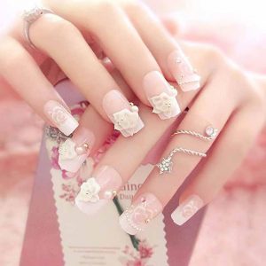 Latest white floral nail art with pearls for engagement