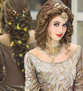Twisted braid and curly hairstyle for Pakistani engagement brides